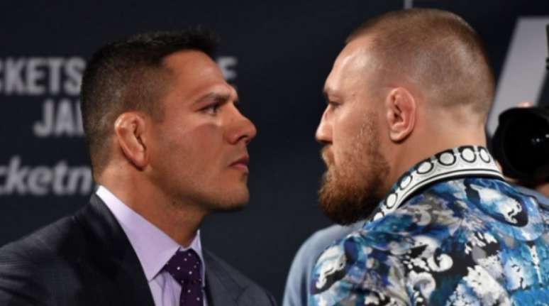 Rafael dos Anjos e Conor McGregor se encaram no UFC 197 (FOTO: Reprodução)