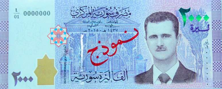O presidente Bashar al-Assad apareceu na moeda da Síria pela primeira vez ao ter seu retrato impresso em uma nova nota de 2.000 libras sírias colocada em circulação neste domingo.