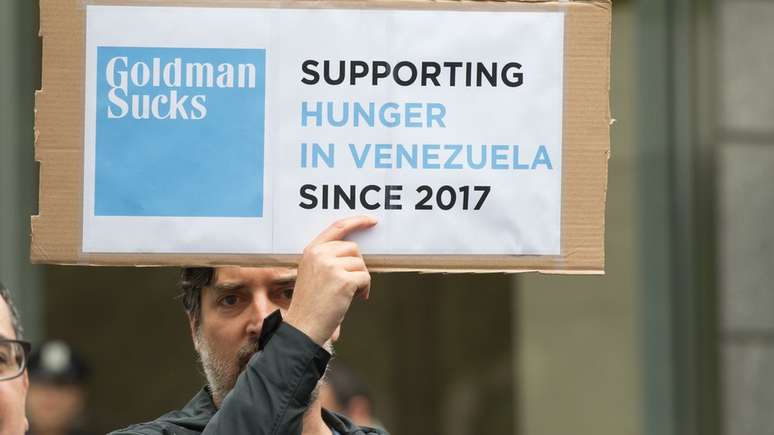 Cartaz de protesto contra o Goldman Sachs