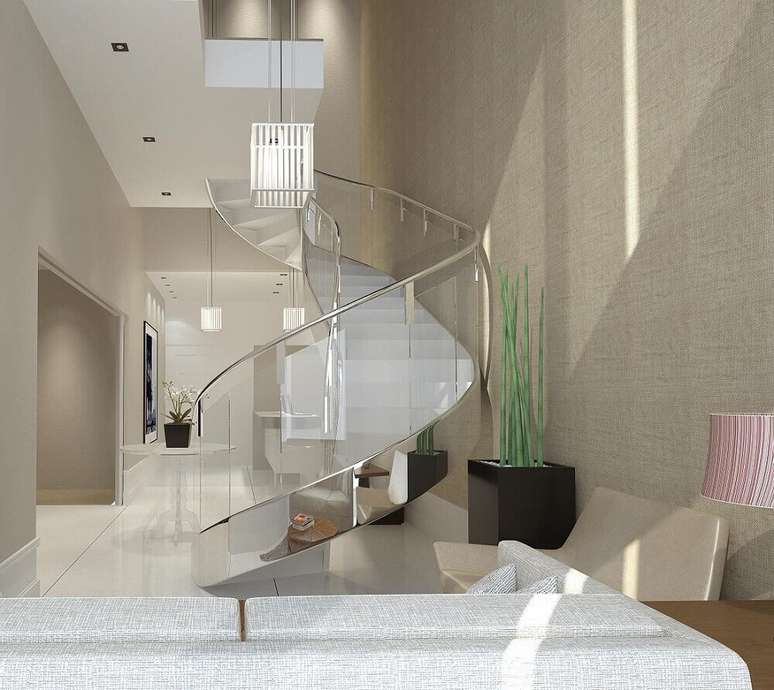 25. Decora&ccedil;&atilde;o linda e sofisticada com escada caracol de concreto com corrim&atilde;o de a&ccedil;o inox