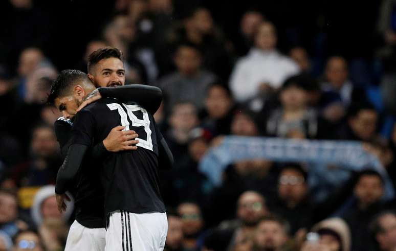 Lanzini e Banega comemoram gol da Argentina contra a It&aacute;lia
 23/3/2018     REUTERS/Phil Noble     