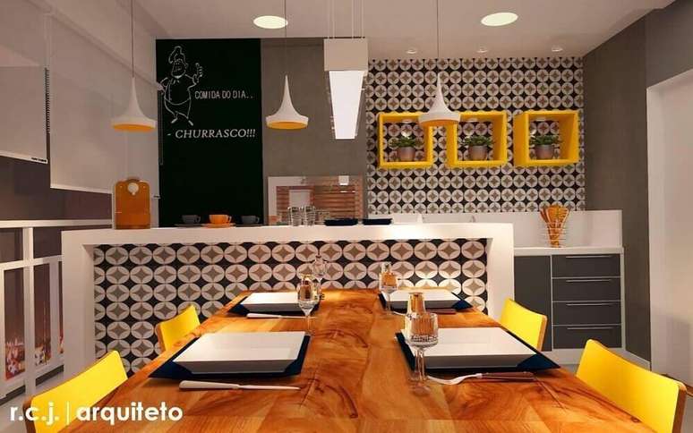 34. Varanda gourmet decorada com tons de laranja e revestimento hidráulico nas paredes