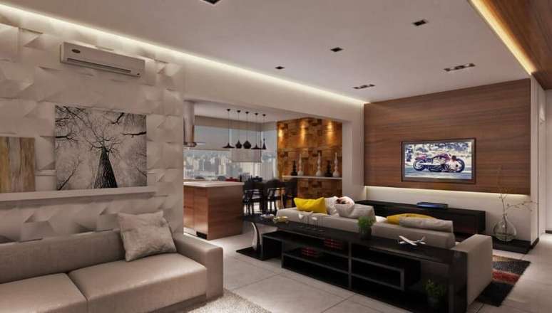 53. Revestimento com efeito 3D e de madeira na sala de estar. Projeto de Raduan Arquitetura