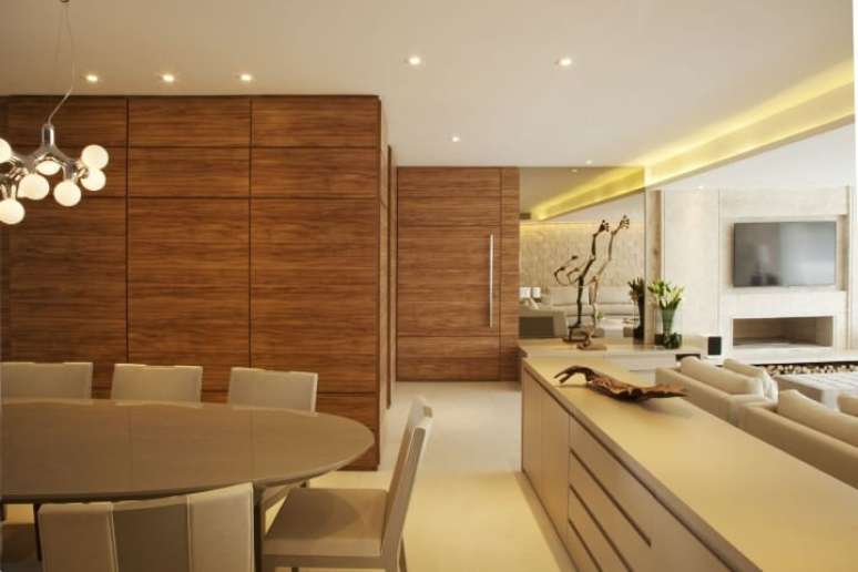47. O aparador para sala de jantar é uma boa forma para “dividir” salas integradas. Projeto de Bianka Mugnatto