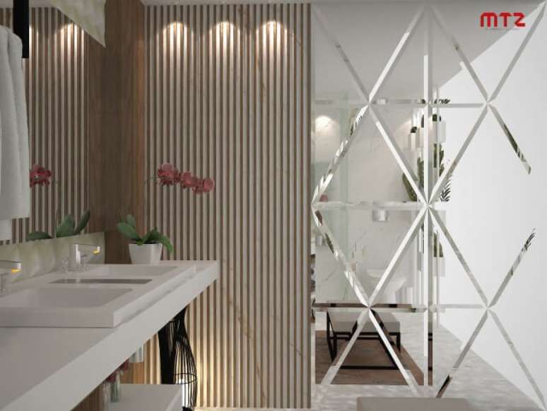 69. Banheiro com parede inteira espelhada. Projeto de Maria Tereza Zucoloto