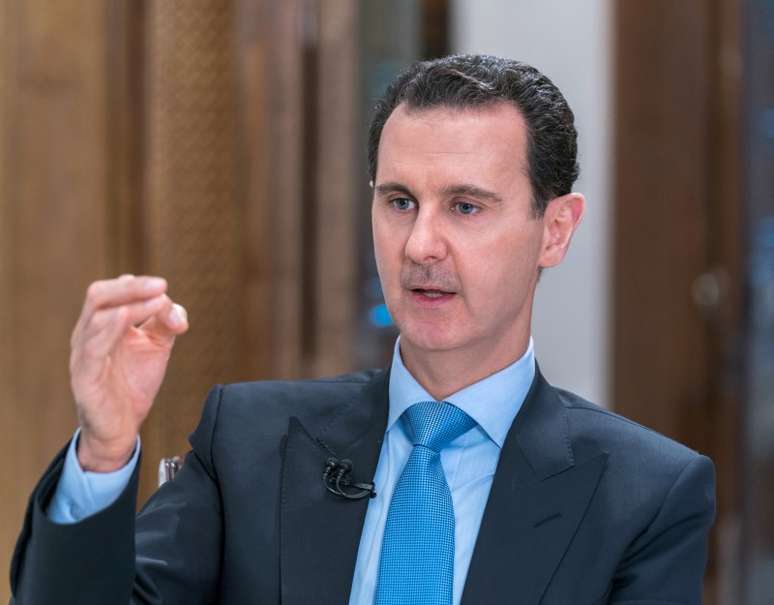 Bashar al-Assad durante entrevista ao canal al-Alam News em Damasco
 13/6/2018    Divulgação/Sana