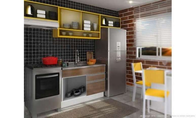 45. O arm&aacute;rio a&eacute;reo amarelo deixa a cozinha modulada mais alegre. Projeto de Lojas KD