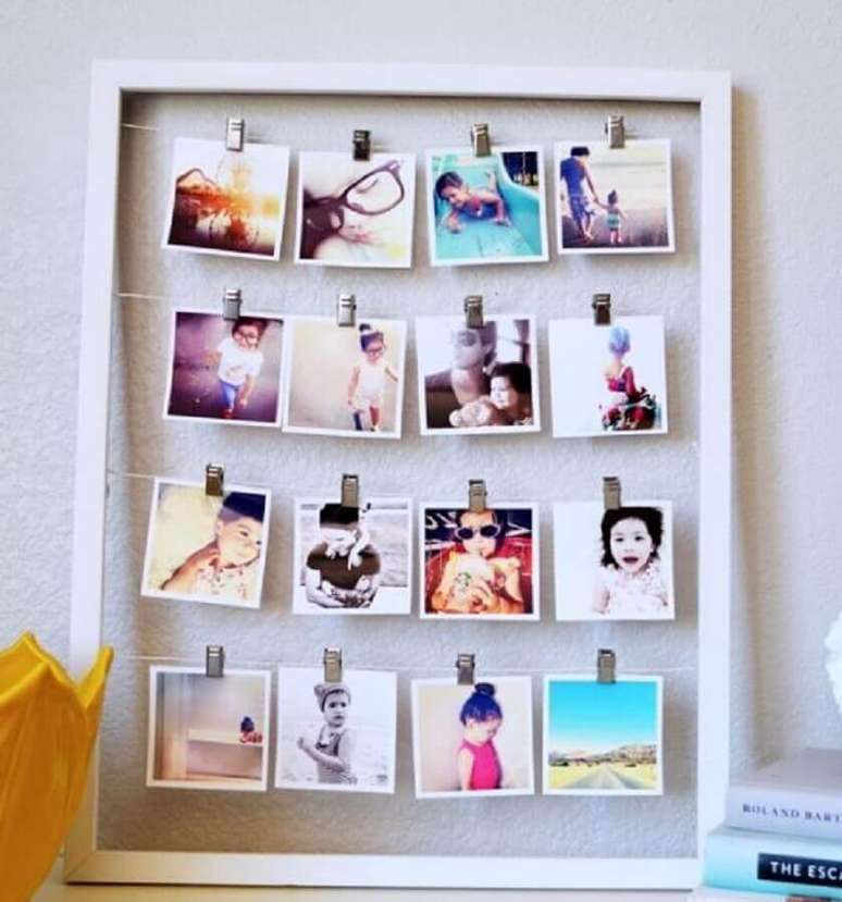 35. Mural de fotos feito com moldura branca simples