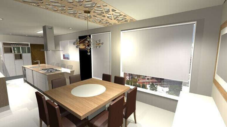 48- Pequena mesa para sala de jantar quadrada tem no centro um prato girat&oacute;rio. Fonte: Marcia Addor