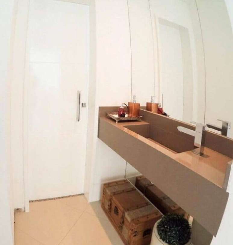 34. Decoração simples para lavabo com pia moldada em silestone – Foto: Arquitetura AEC