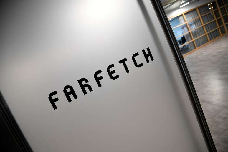 Branding for online fashion house Farfetch is seen at the company headquarters in London, Britain January 31, 2018. REUTERS/Toby Melville - RC1E8E0D9F80