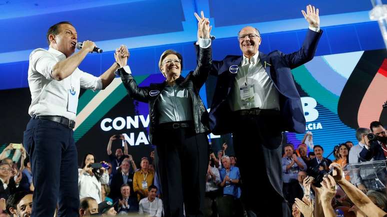 João Doria, Ana Amélia e Geraldo Alckmin em convenção do PSDB em agosto; para cientista político, grupo de Doria conduz partido no sentido contrário à autocrítica