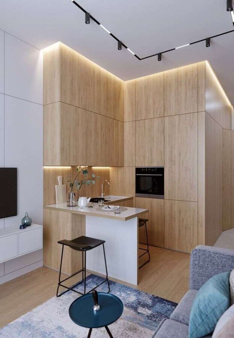 19. Decoração moderna para cozinha planejada para apartamento pequeno com armários de madeira – Foto: Aaron Guides