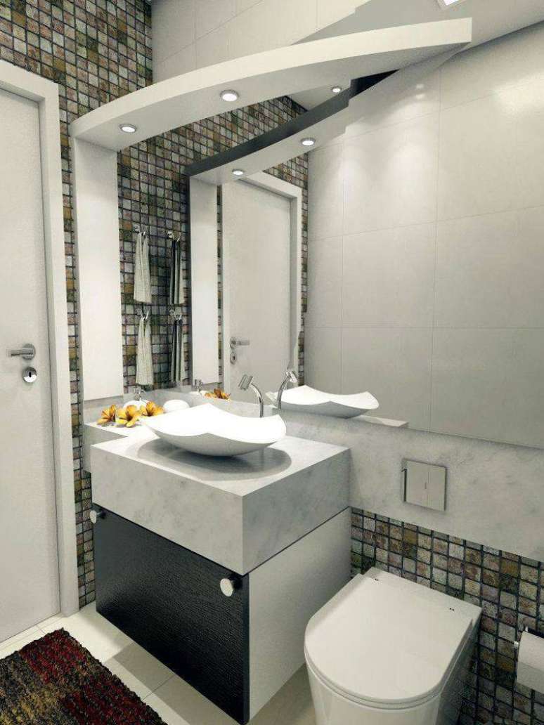 21. Ambiente moderno com uma cuba para banheiro que agrega mais design