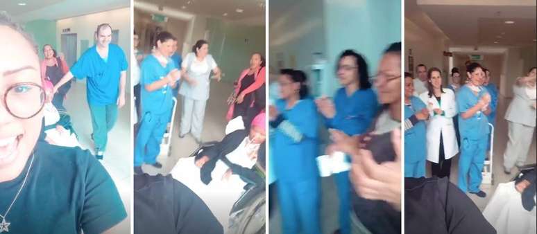Familiares, amigos e funcion&aacute;rios do hospital cantam 'Parab&eacute;ns' para Deise em frente a uma janela da institui&ccedil;&atilde;o.