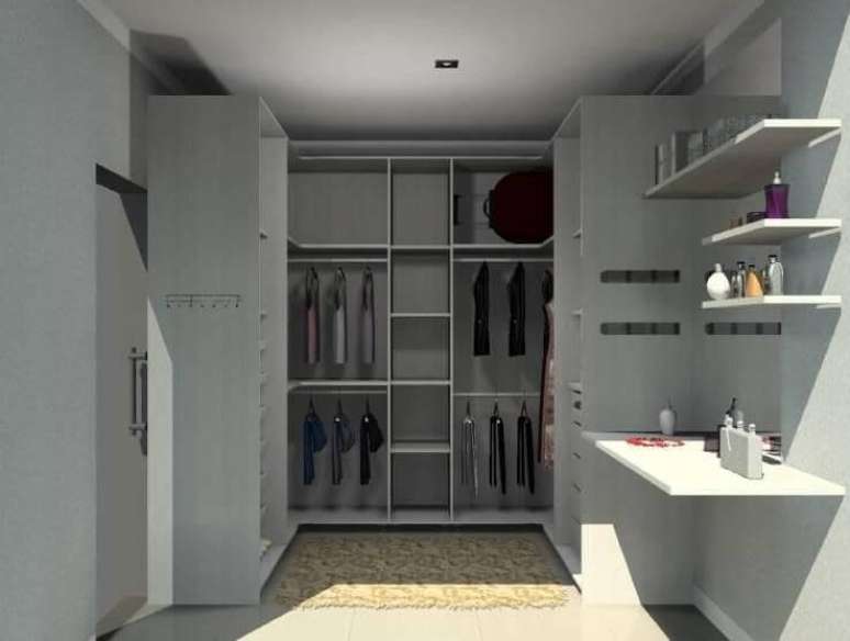11. Closet composto por guarda-roupas planejados. Projeto de Karina Chavare