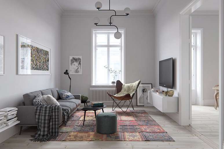 56. Decoração simples para sala com estilo minimalista com manta para sofá e luminária de teto – Foto: Pinterest