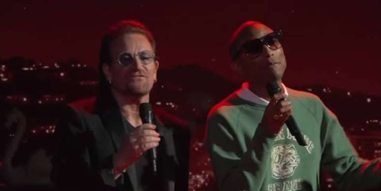 Os cantores Bono Vox e Pharrell Williams.