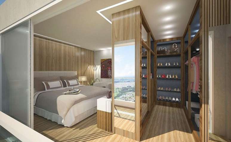 62. Modelo de quarto com closet com revestimento de madeira – Foto: Viga Engenharia