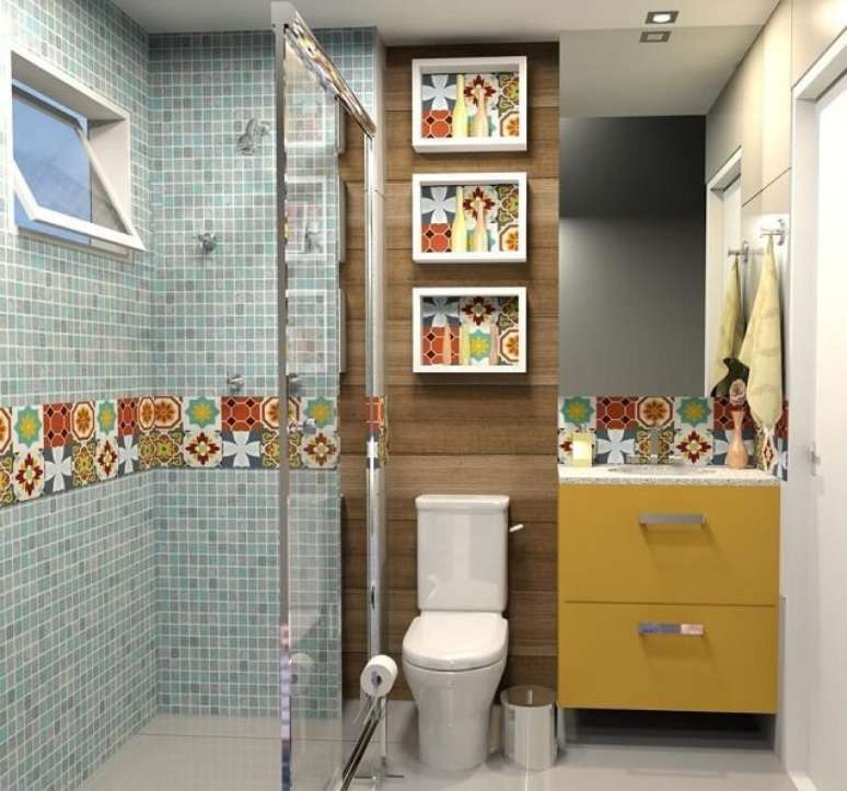 27. Outra boa ideia é fazer um mix nos banheiros com pastilhas usando também azulejos. Projeto de Ad Arquitetura e Interiores