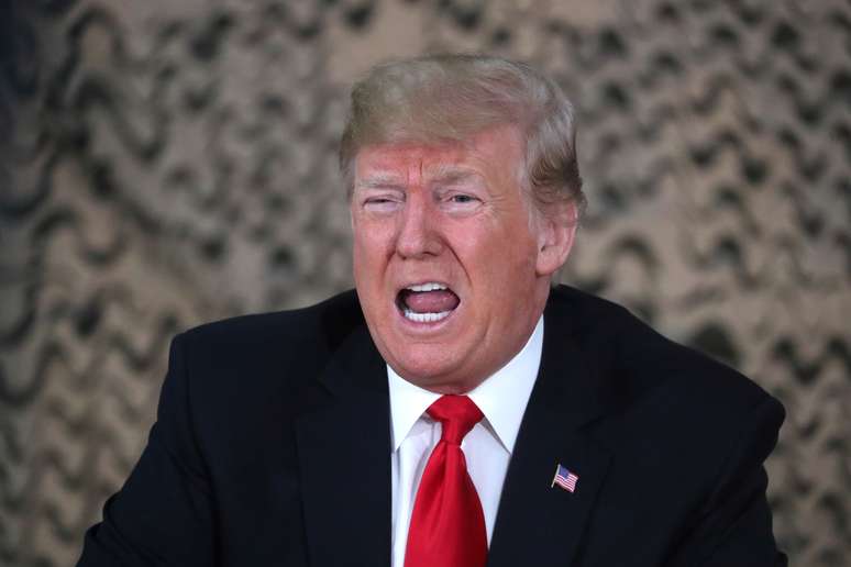 U.S. President Donald Trump speaks to reporters as he meets U.S. political and military leaders during an unannounced visit to Al Asad Air Base, Iraq December 26, 2018. REUTERS/Jonathan Ernst - RC1E45148E80