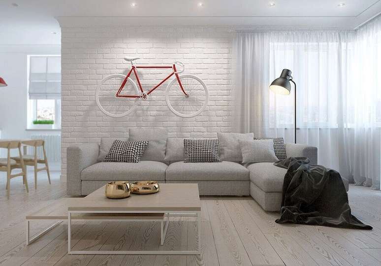 12. A manta para sofá além de deixar a decoração mais bonita também leva sensação de conforto ao ambiente – Foto: Design Bilder
