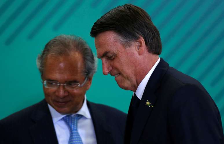 Brazil's President Jair Bolsonaro and Economy Minister Paulo Guedes attend a ceremony at the Planalto Palace in Brasilia, Brazil January 7, 2019. REUTERS/Adriano Machado