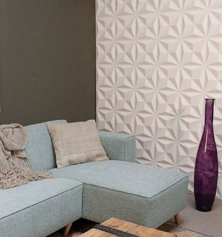 9. Decoração com sofá azul e revestimento 3D parede sala de estar – Foto: Admirato