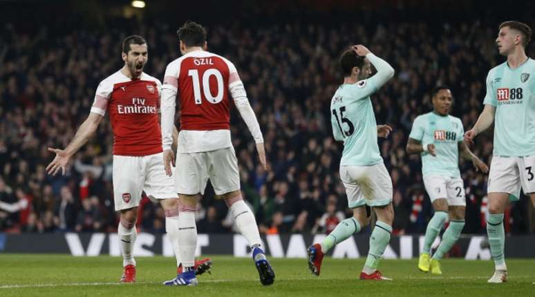 Mkhitaryan e Ozil foram os destaques da partida (Foto: IAN KINGTON / AFP)