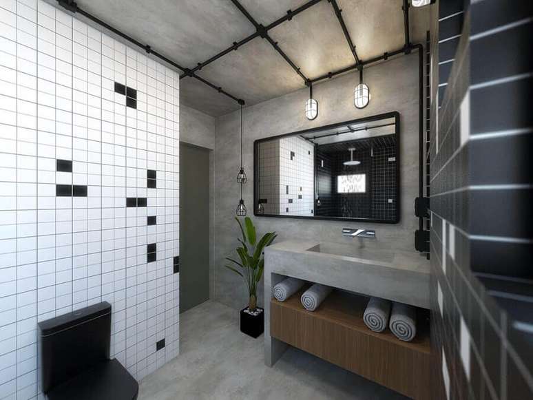43. Banheiro masculino decorado com cimento queimado e tubulação aparente – Foto: Térreo Arquitetos