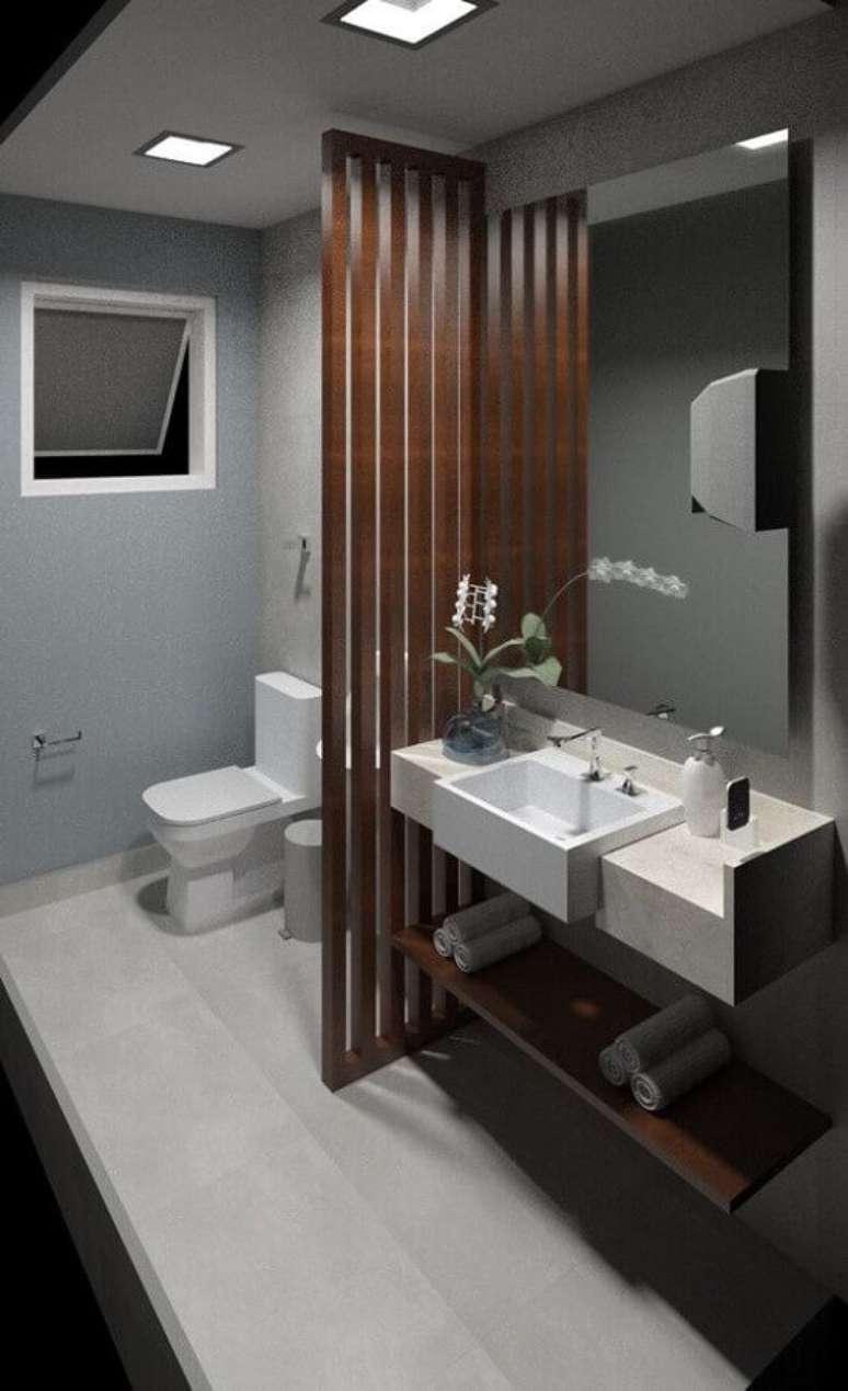 54. Banheiro masculino decorado todo cinza com divisória de madeira – Foto: Archtrends Portobello
