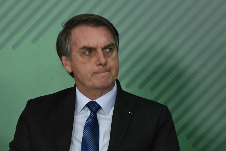 O presidente da República, Jair Bolsonaro (PSL), durante solenidade de sanção da Lei de Cadastro Positivo realizada no Palácio do Planalto, em Brasília, na tarde desta segunda-feira, 8 de abril de 2019