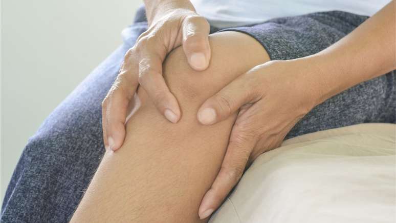 Woman holding a sore knee