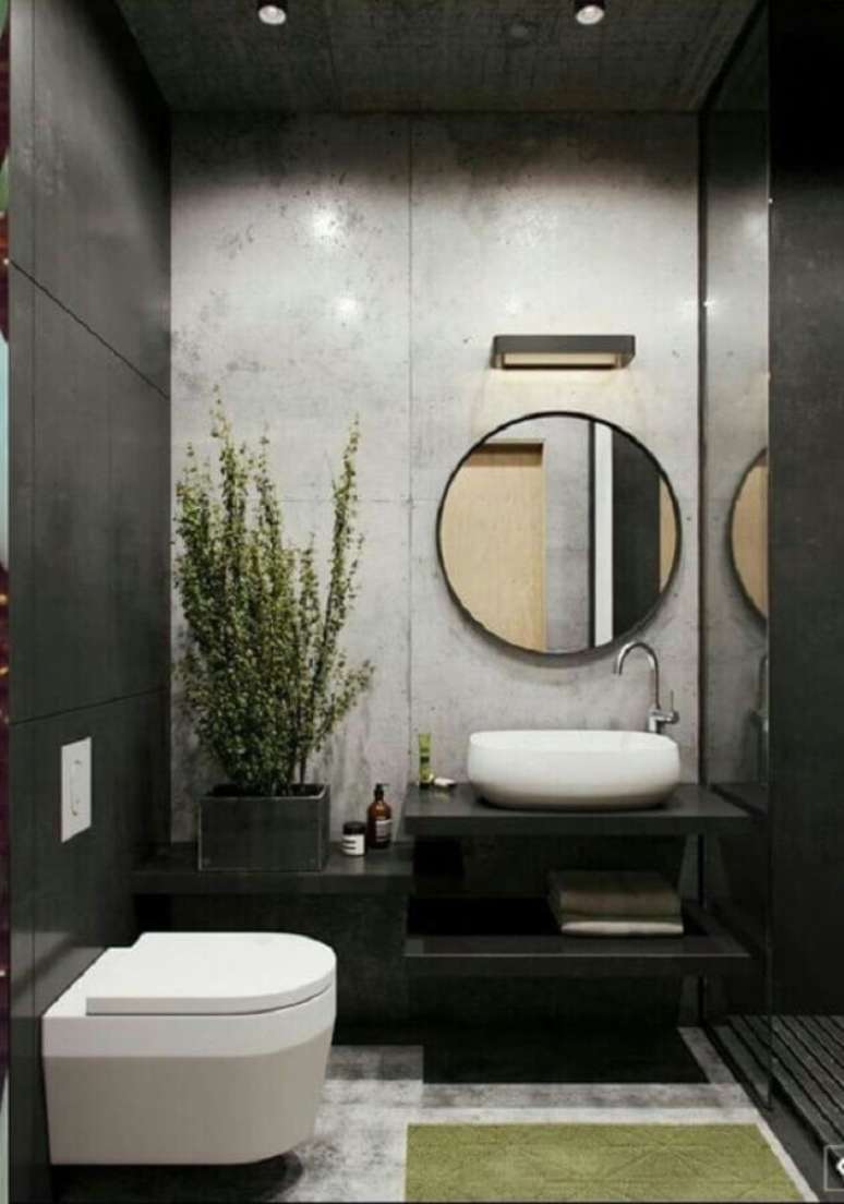 55. Decoração moderna em cinza e preto para lavabo pequeno com espelho redondo – Foto: Behance