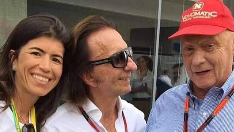 Fittipaldi com a mulher e Niki Lauda duante GP do Brasil