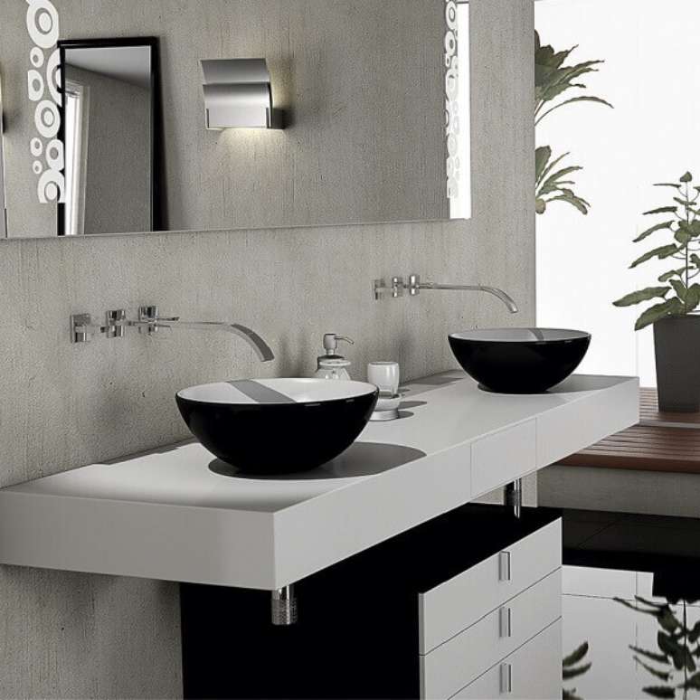 12- A pia de porcelanato para banheiro tem duas cubas de louça preta. Fonte: Magazine Luiza