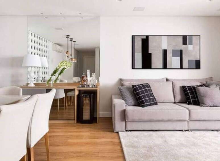 46. Decoração em tons neutros para sala de estar e jantar integradas – Foto: Casa Moderna Móveis