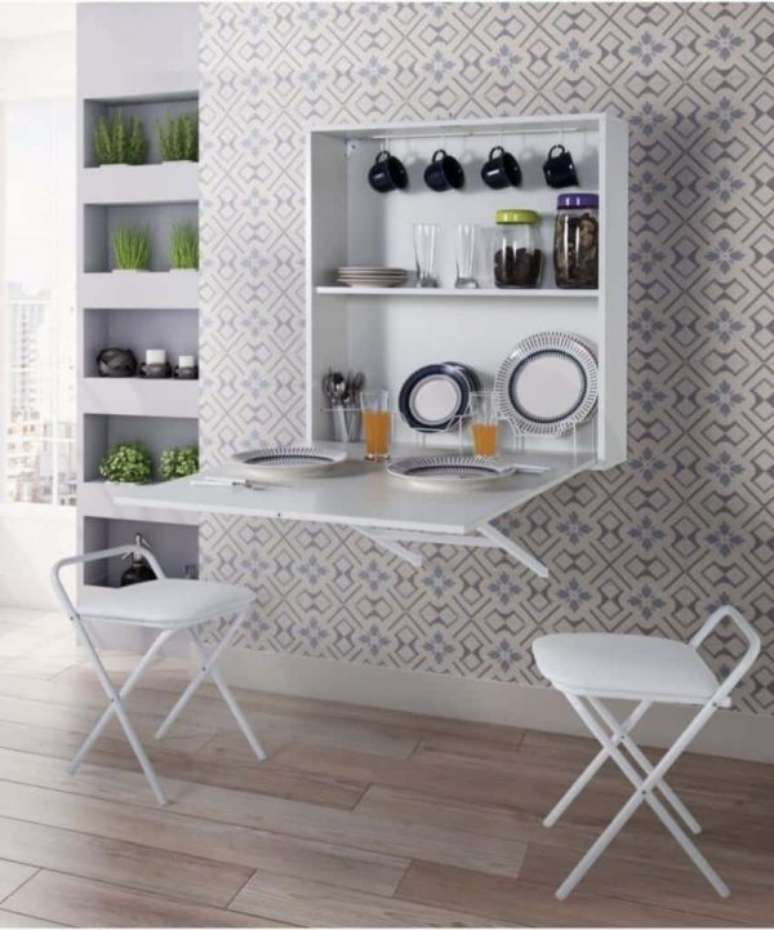 55. Mesa dobr&aacute;vel de parede com arm&aacute;rio de cozinha
