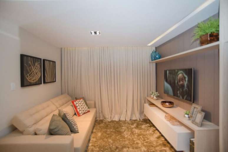 31. Os modelos de sofá reclináveis são ótimos para sala de TV. Projeto de Andrea Fonseca