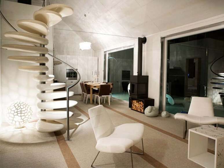 18. Escada com degraus flutuantes circular com corrimão metálico. Fonte: All Architecture Designs