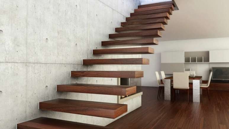 16. Escada com degraus flutuantes de madeira fixada em parede de concreto. Fonte: Pinterest
