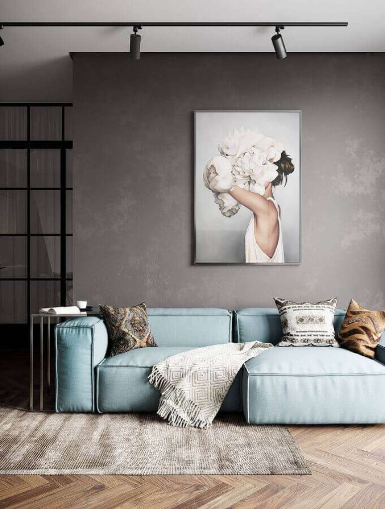 46. Sofá modernos para sala com estilo contemporânea decorada com parede de cimento queimado e spots de luz – Foto: Behance
