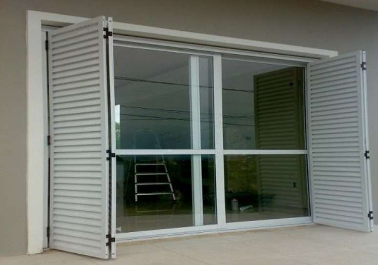 26. A porta balc&atilde;o pode brincar com as formas. Foto: Decorando Casas