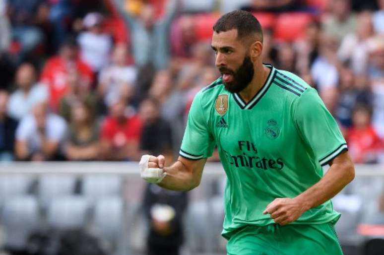 Benzema fez um hattrick no jogo desta quarta-feira (Foto: SVEN HOPPE/DPA/AFP)