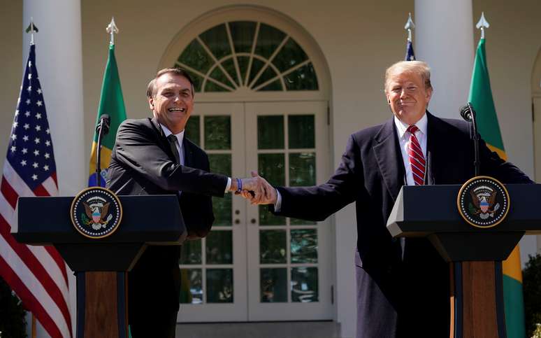Brazil's President Jair Bolsonaro shakes hands with U.S. President Donald Trump at the conclusion of a joint news conference in the Rose Garden of the White House in Washington, U.S., March 19, 2019. REUTERS/Kevin Lamarque