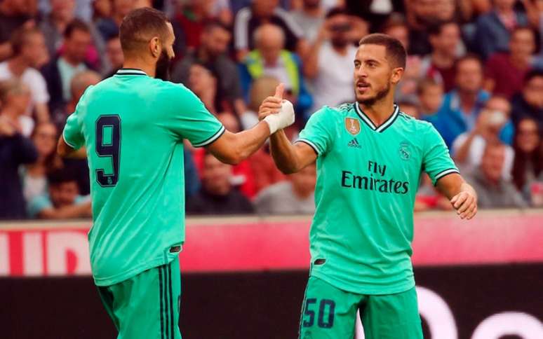 Hazard marcou um belo gol após passe de Benzema e garantiu a vitória do Real Madrid (Foto: KRUGFOTO/APA/AFP)