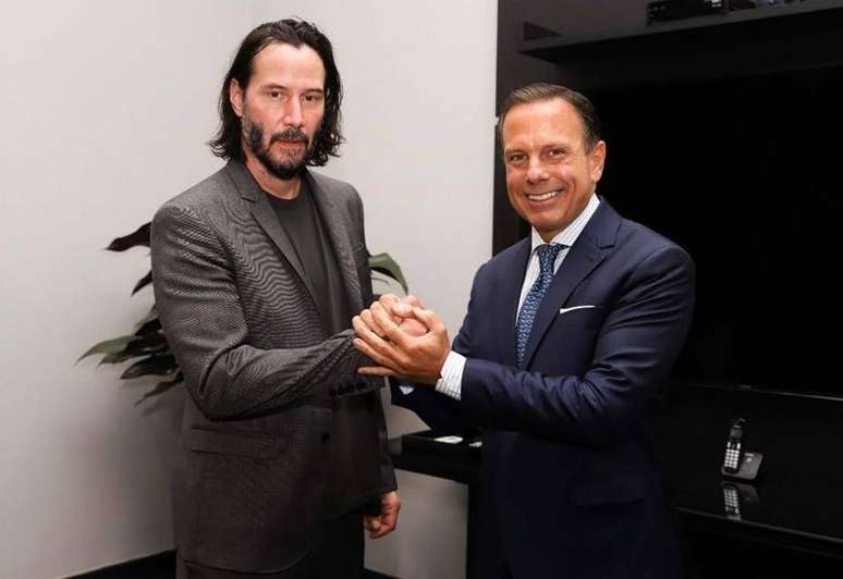 O ator Keanu Reeves e o governador de São Paulo, João Doria.