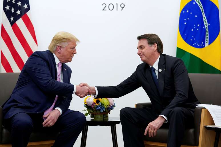 Brazil's President Jair Bolsonaro and U.S. President Donald Trump shake hands during a bilateral meeting at the G20 leaders summit in Osaka, Japan, June 28, 2019.  REUTERS/Kevin Lamarque - RC166D688890