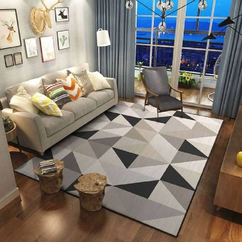 49. Tapete geométrico cinza para sala de estar decorada com almofadas coloridas – Foto: AliExpress