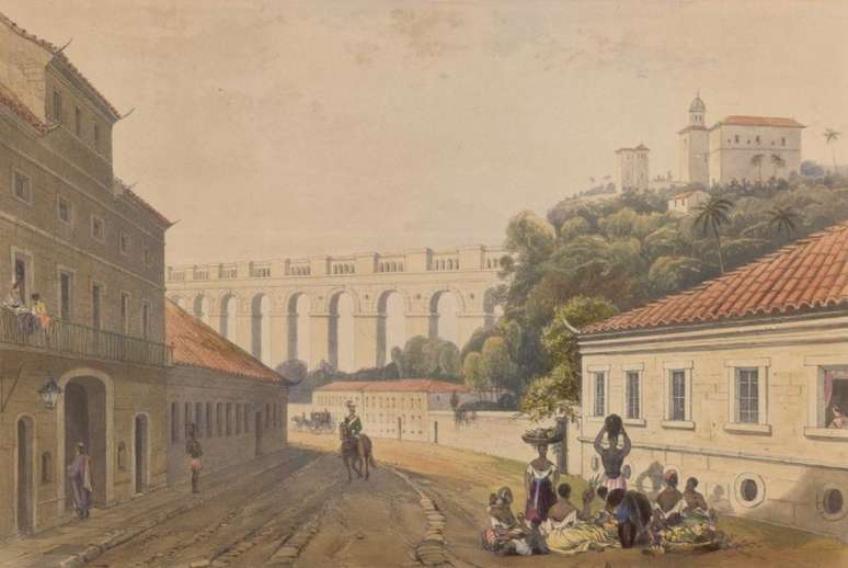 Gravura de Jonathan Needham mostra o Aqueduto da Carioca, mais tarde conhecido como Arcos da Lapa. A construção, do século 18, trazia a água das nascentes do rio da Carioca, ao longo das encostas da serra de Santa Teresa, até o Largo da Carioca